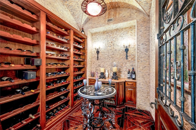 wine room with lofted ceiling