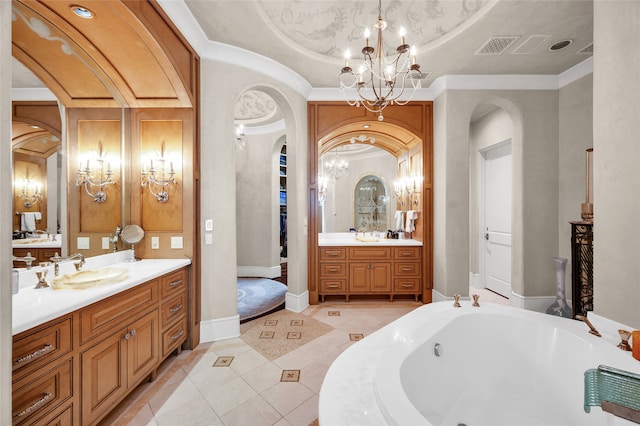 bathroom featuring tile patterned floors, a bathtub, vanity, and a notable chandelier