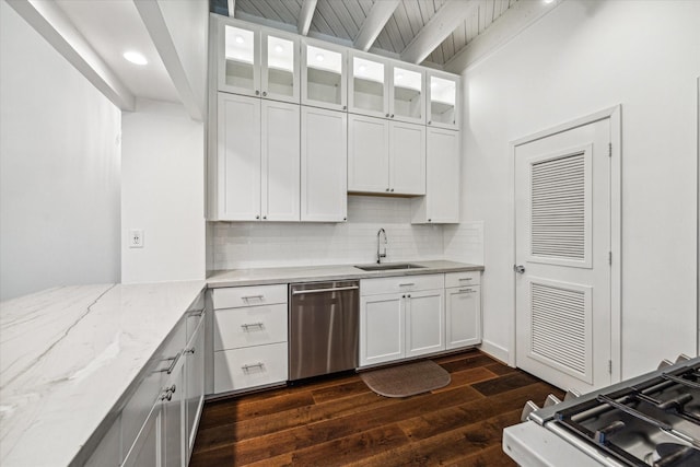 kitchen featuring sink, white cabinets, decorative backsplash, stainless steel dishwasher, and light stone countertops