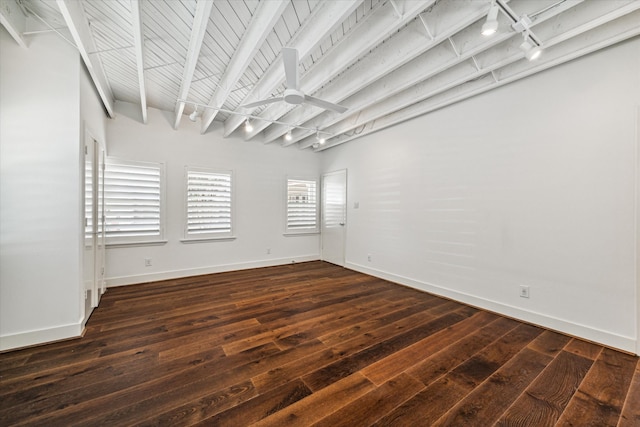 empty room with dark hardwood / wood-style floors, ceiling fan, wood ceiling, track lighting, and beam ceiling