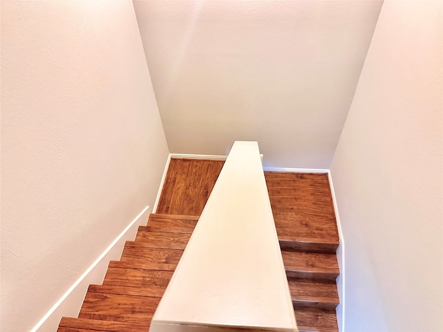 stairway featuring hardwood / wood-style flooring