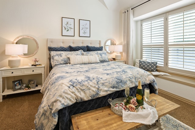 carpeted bedroom featuring vaulted ceiling