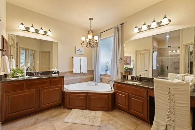 bathroom with a chandelier, vanity, plenty of natural light, and plus walk in shower