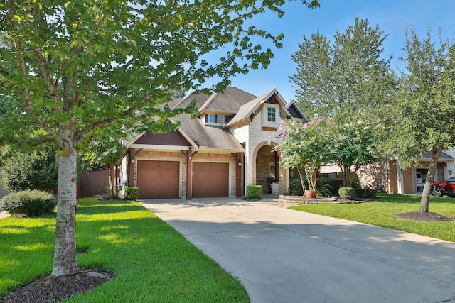 craftsman-style house featuring a garage and a front lawn