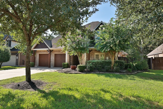 view of front facade with a garage and a front lawn