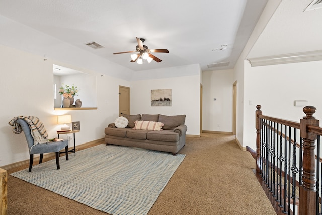 carpeted living room with ceiling fan