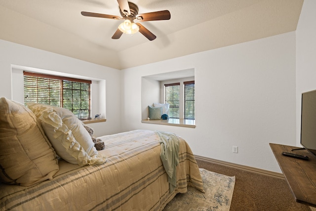 bedroom with carpet, ceiling fan, and multiple windows