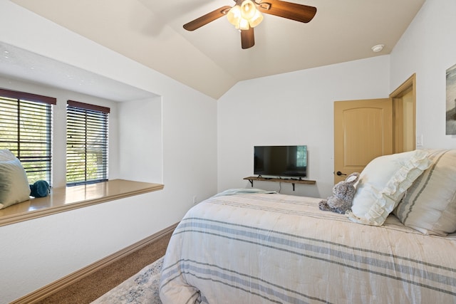 bedroom with carpet, ceiling fan, and vaulted ceiling