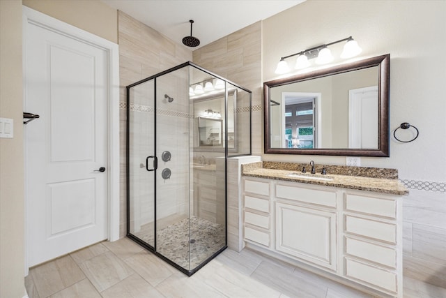 bathroom with vanity and an enclosed shower