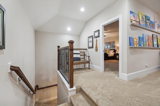 stairs with carpet and vaulted ceiling