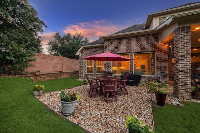 patio terrace at dusk with a lawn