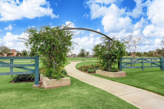 view of home's community with a lawn