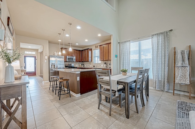 dining area with light tile patterned floors