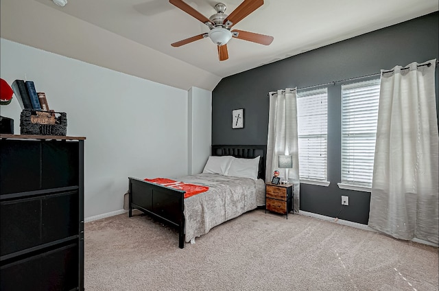 carpeted bedroom featuring ceiling fan and lofted ceiling