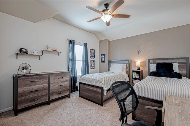 carpeted bedroom with ceiling fan and vaulted ceiling