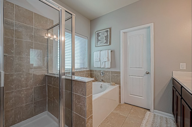 bathroom featuring tile patterned floors, vanity, and plus walk in shower