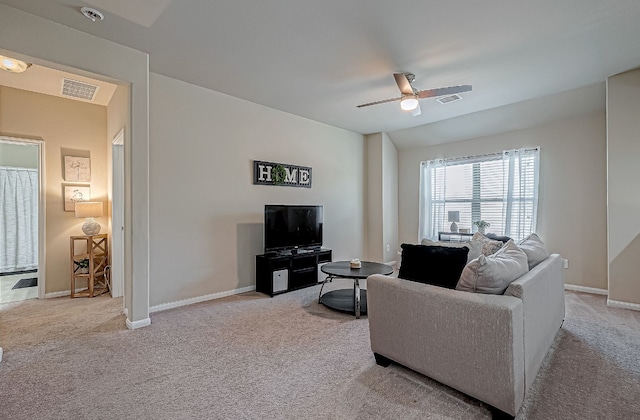 carpeted living room featuring ceiling fan