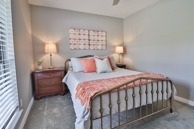 bedroom with ceiling fan and dark colored carpet