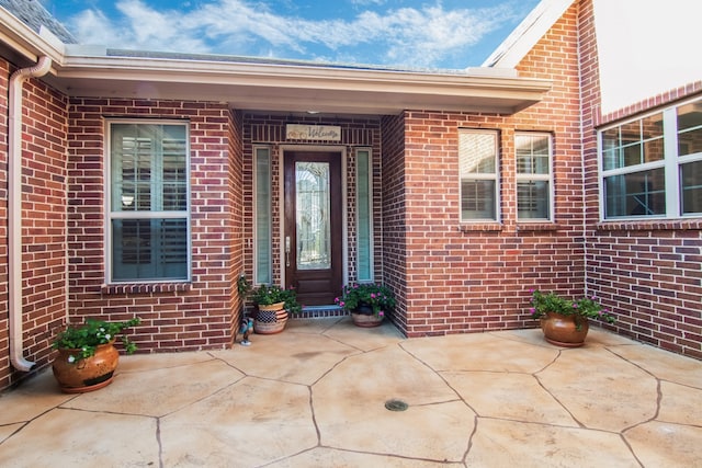 doorway to property featuring a patio