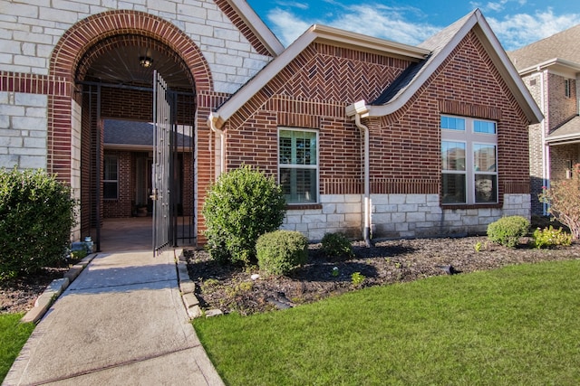 property entrance with a yard