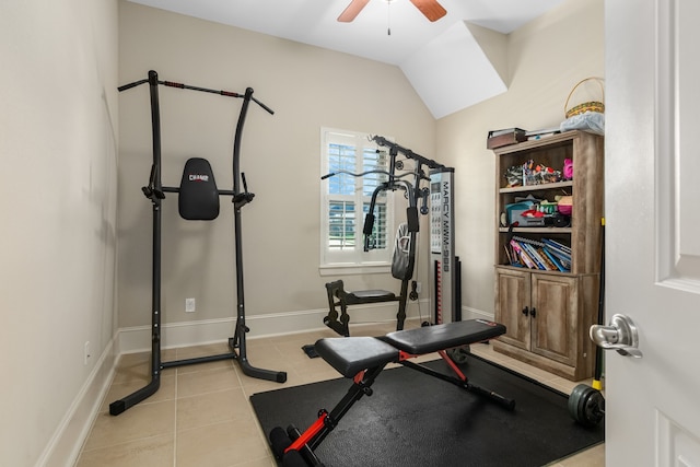 exercise room featuring ceiling fan, lofted ceiling, and light tile patterned floors