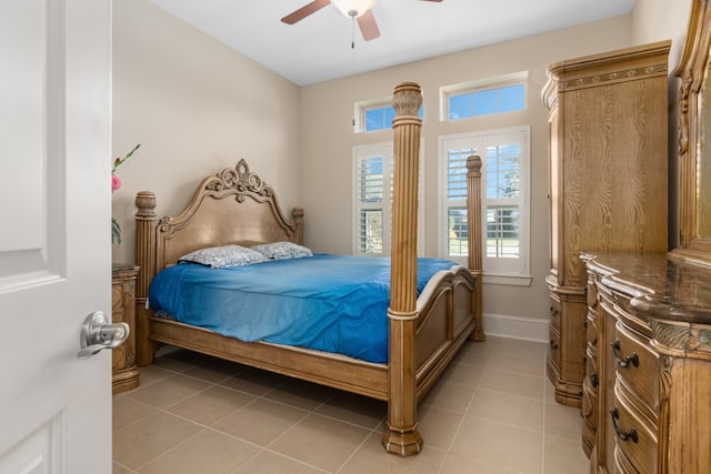 tiled bedroom featuring ceiling fan