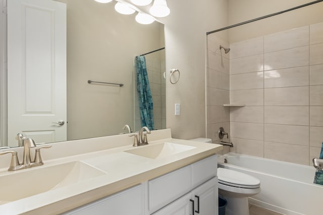 full bathroom featuring vanity, toilet, and shower / tub combo