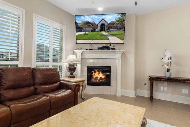 tiled living room with a tiled fireplace