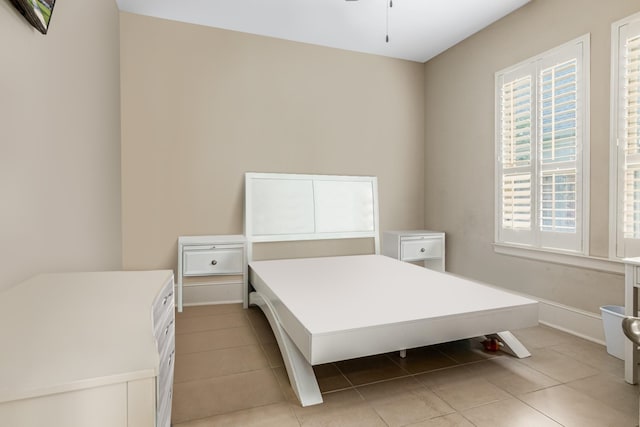 bedroom featuring light tile patterned floors