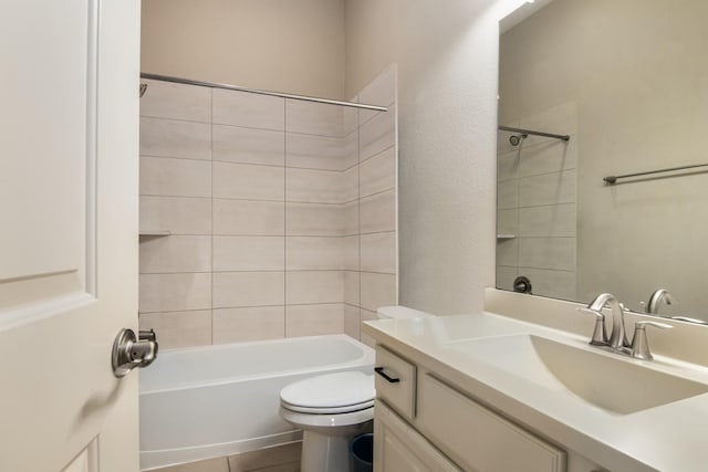 full bathroom with tile patterned flooring, vanity, toilet, and tiled shower / bath