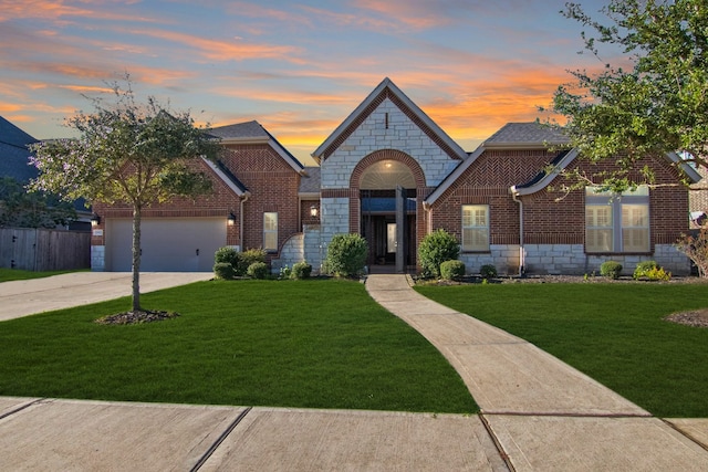 view of front of home with a lawn