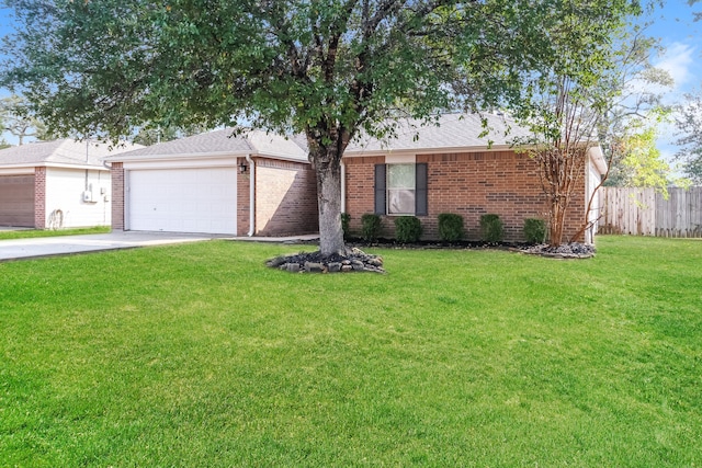 single story home with a garage and a front lawn