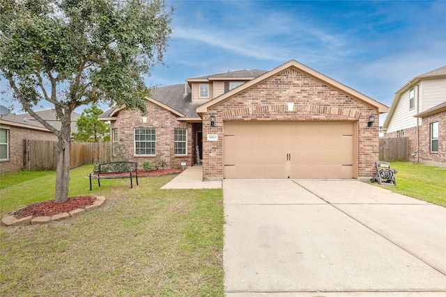 view of front facade featuring a garage and a front yard