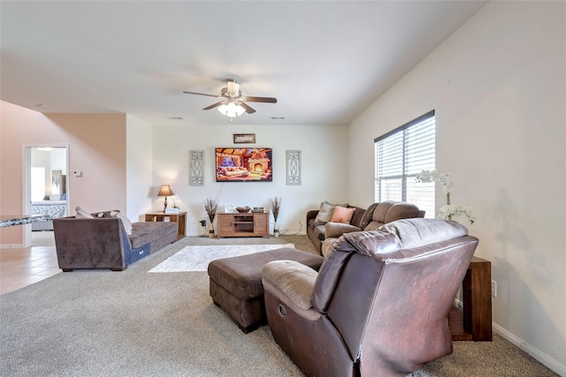 living room featuring ceiling fan and carpet