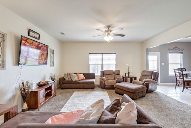 living room with ceiling fan and light carpet