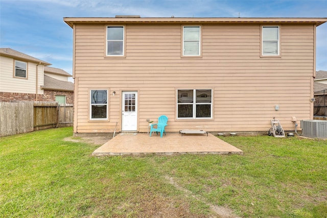 back of house featuring a yard, a patio, and central AC unit