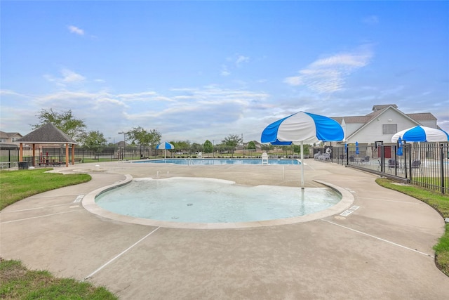 view of pool featuring a gazebo and a patio