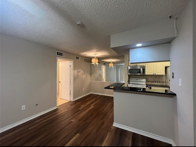 kitchen featuring kitchen peninsula, a textured ceiling, white electric range, dark hardwood / wood-style floors, and white cabinetry