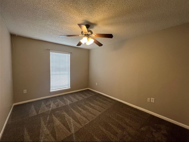 carpeted spare room featuring ceiling fan and a textured ceiling