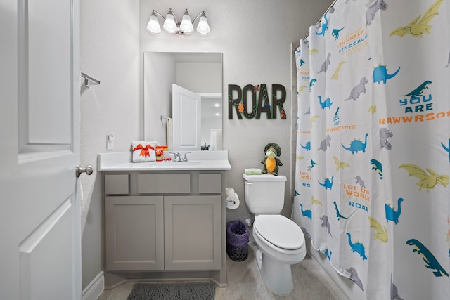 bathroom with tile patterned flooring, vanity, curtained shower, and toilet