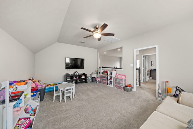 playroom featuring carpet flooring, ceiling fan, and vaulted ceiling