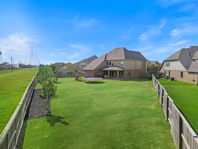 view of yard with a trampoline