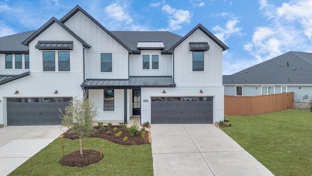 modern farmhouse with a garage and a front yard