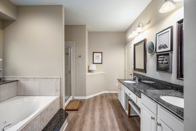 bathroom featuring vanity, shower with separate bathtub, and hardwood / wood-style flooring