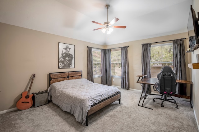 bedroom featuring ceiling fan, light carpet, and vaulted ceiling