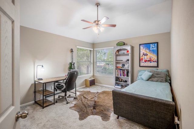 carpeted office with ceiling fan and vaulted ceiling