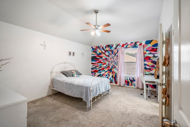 bedroom featuring ceiling fan, carpet floors, and vaulted ceiling