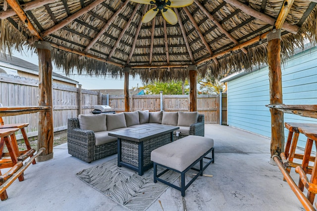 view of patio / terrace featuring a gazebo, ceiling fan, and outdoor lounge area