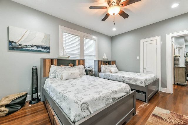 bedroom featuring ceiling fan and dark hardwood / wood-style flooring