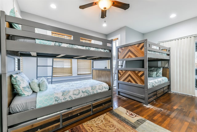 bedroom with ceiling fan and dark wood-type flooring